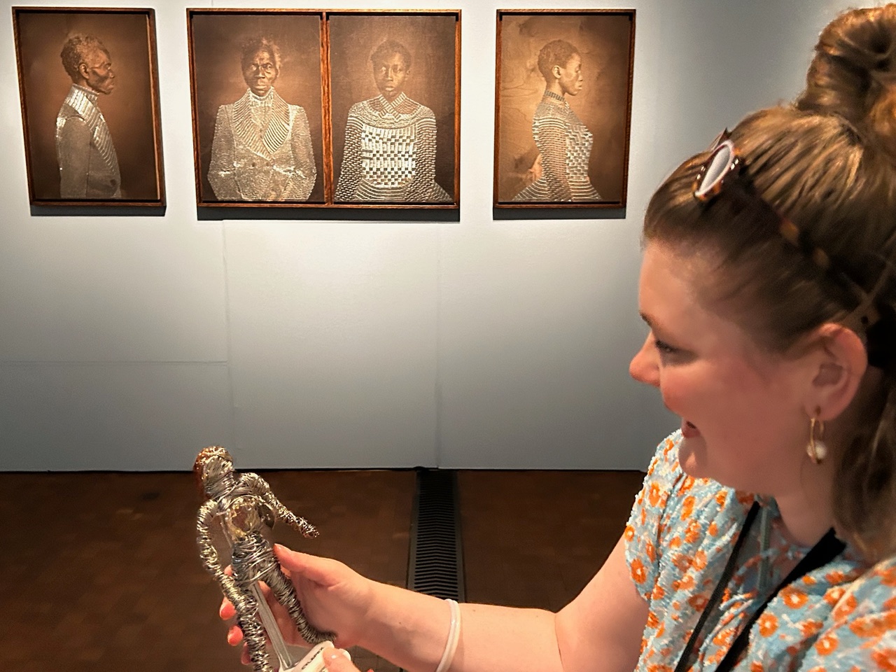 Lisa Roulet, Museum Rietberg's Exhibition Assistant, smiles with pleasure upon receiving Vernon Houston's artwork.
